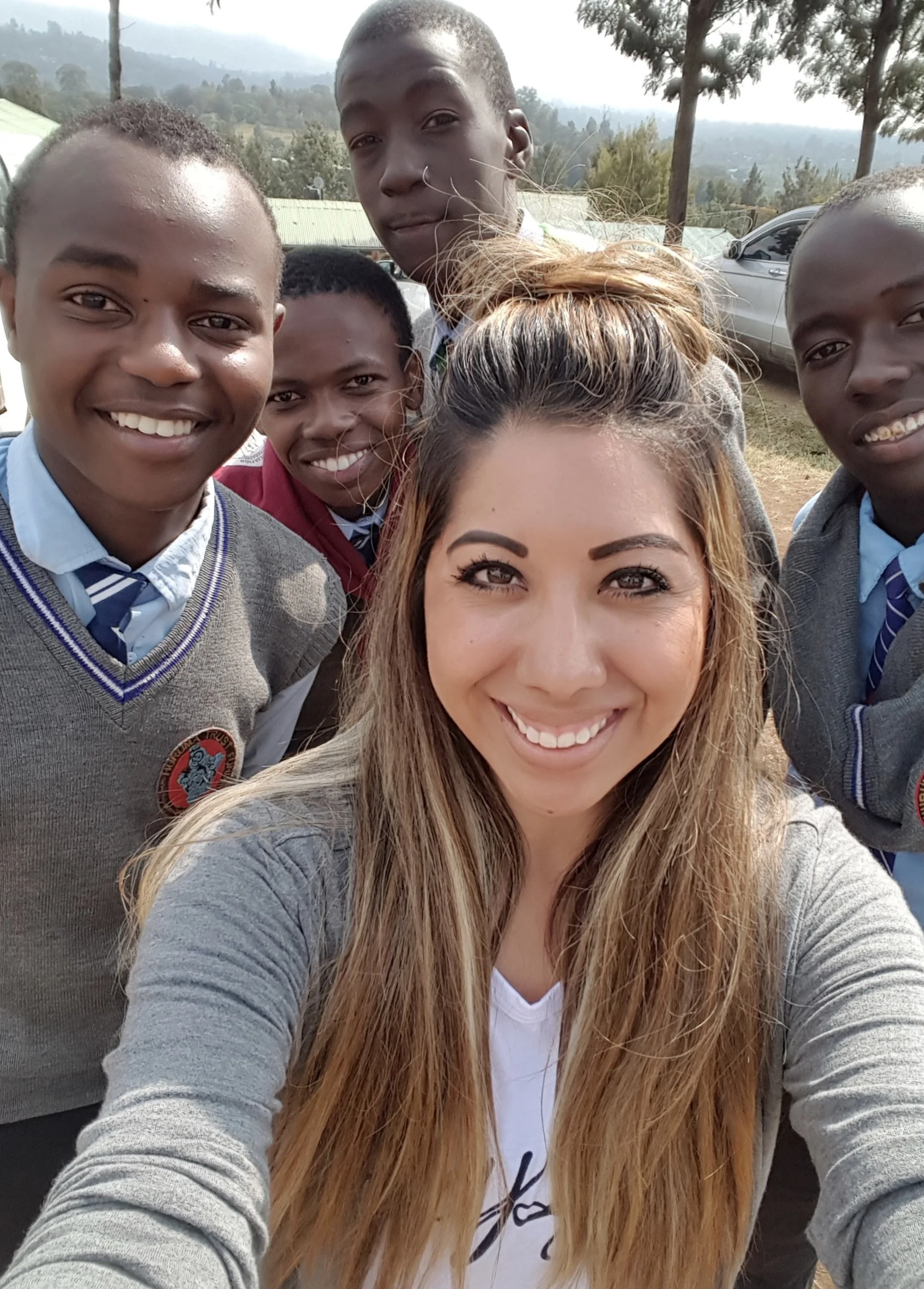 Seren Maro, board member, along with some of Huruma's high school boys.