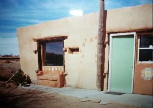 The lowly mud hut whence we came.