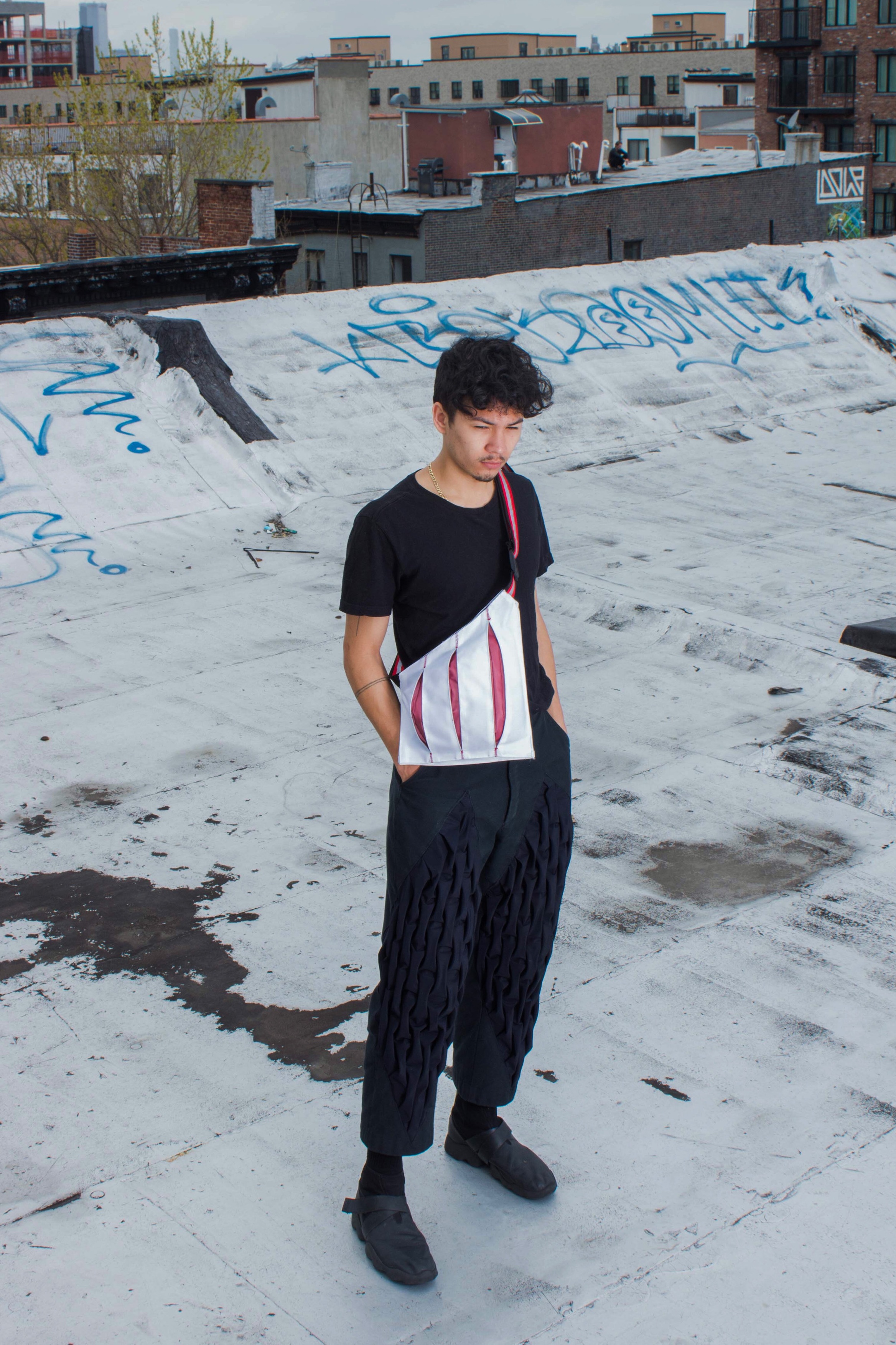 BLOODWORK is a flat-packable expanding messenger bag with 3M reflective pleats that begin to show as the bag is filled.