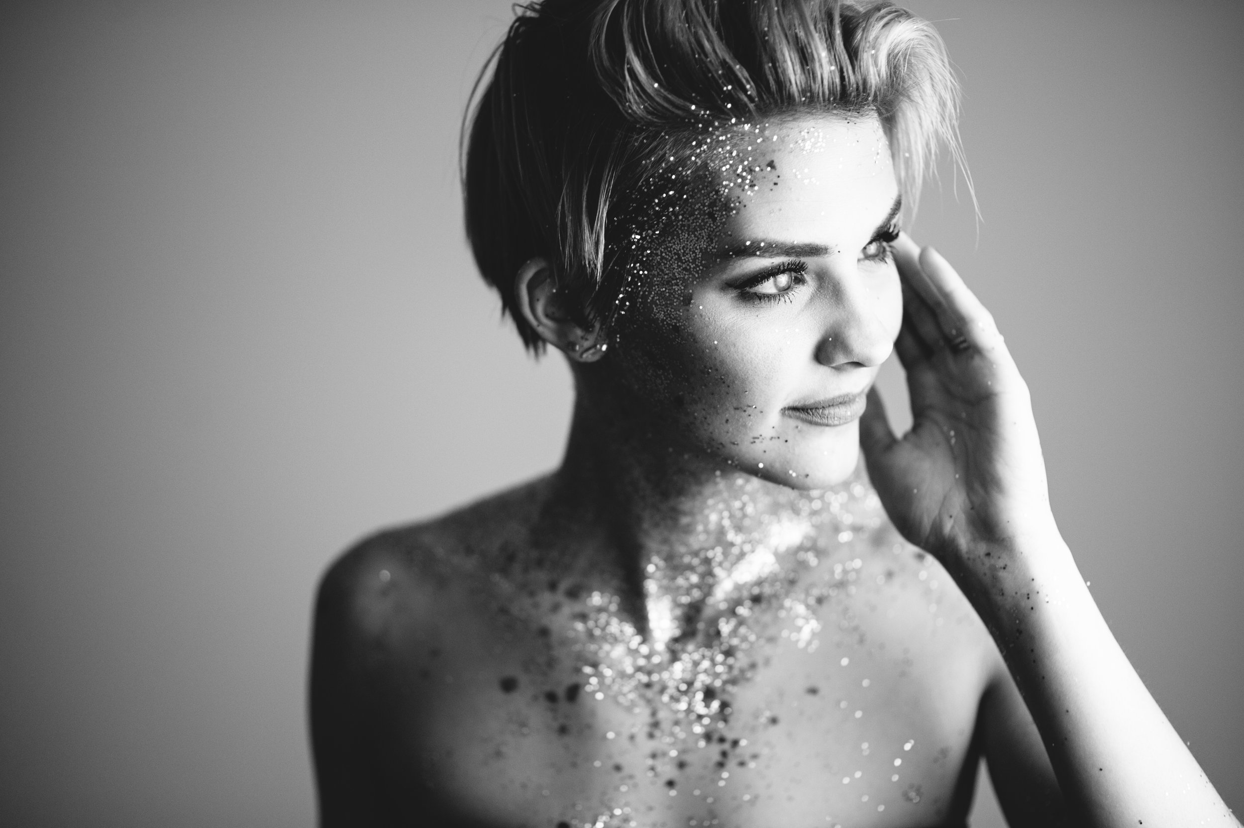 Nightbirde artist pop artist breast cancer. Hopeful music. short hair glitter black and white photo shoot younger short blonde hair