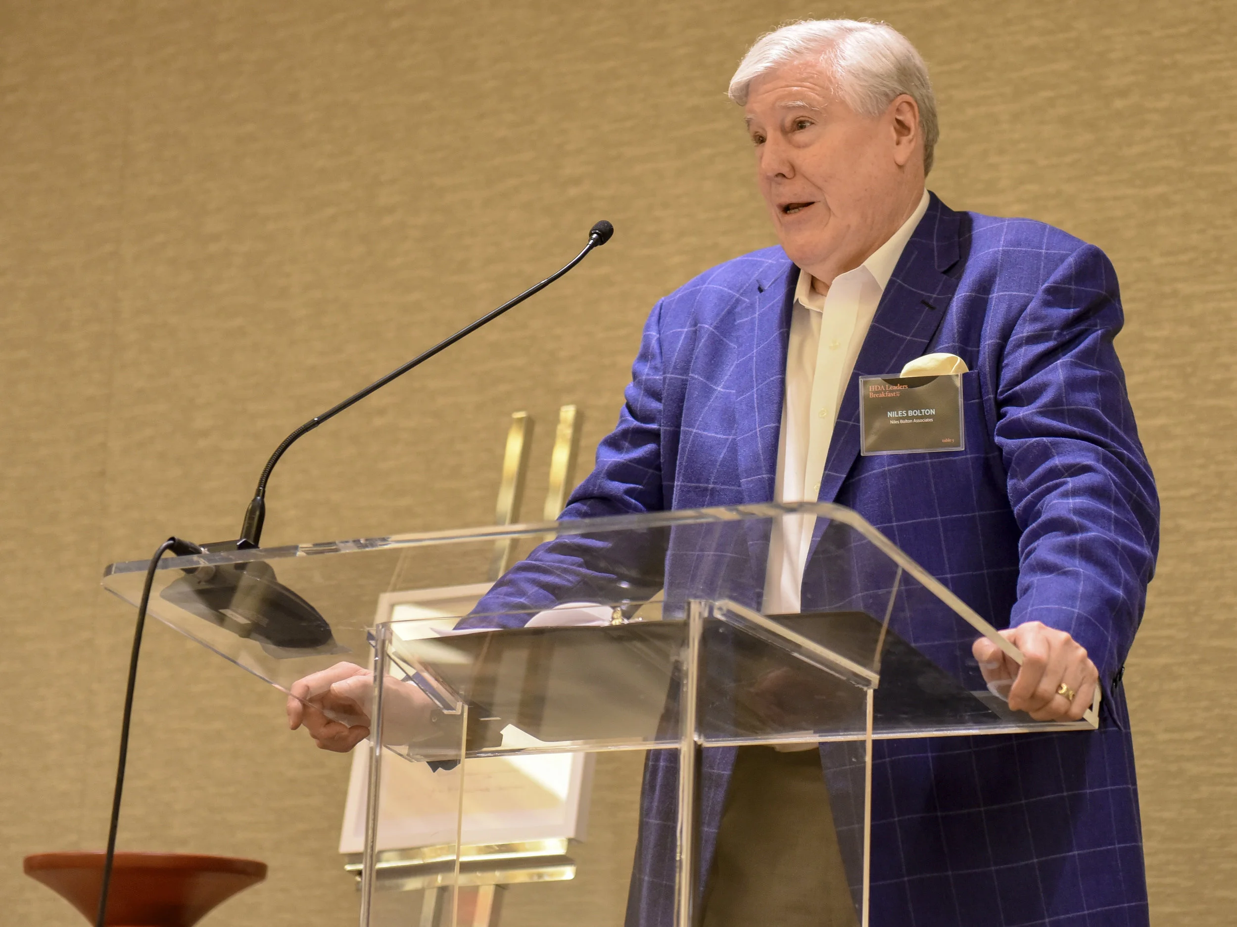 Chairman and CEO, Niles Bolton, giving an introduction speech for Stephanie