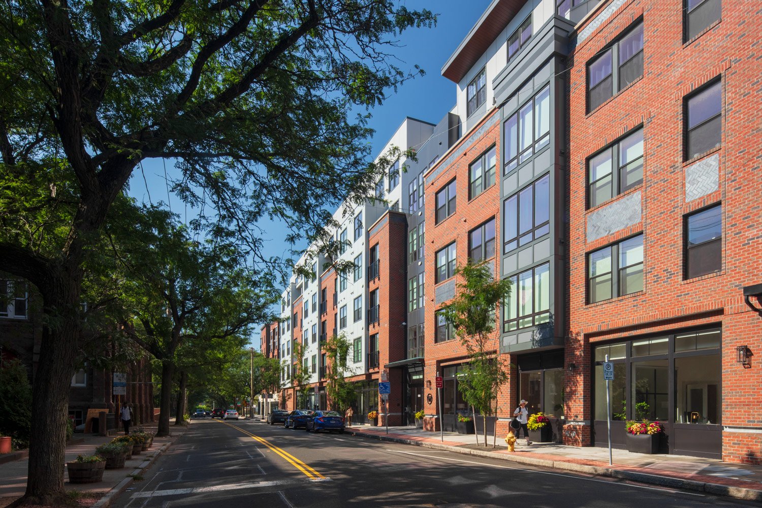 A pedestrian walks through Town Brookhaven, a mixed-use