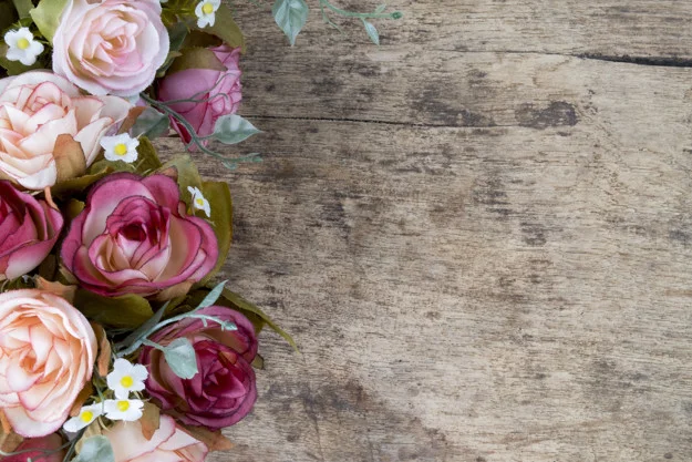 rose-flowers-on-rustic-wooden-background-copy-space_1421-597.jpg