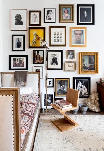Marcus Teo’s Townhouse gallery wall brings together different styles of art through a theme: Portraiture. Frames and artistic styles are different, but pieces are linked through their subject matter. Photo by Marta Perez for The Maryn