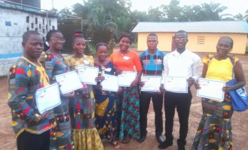 Great King Academy elementary teachers with Liberia Reads! certificates