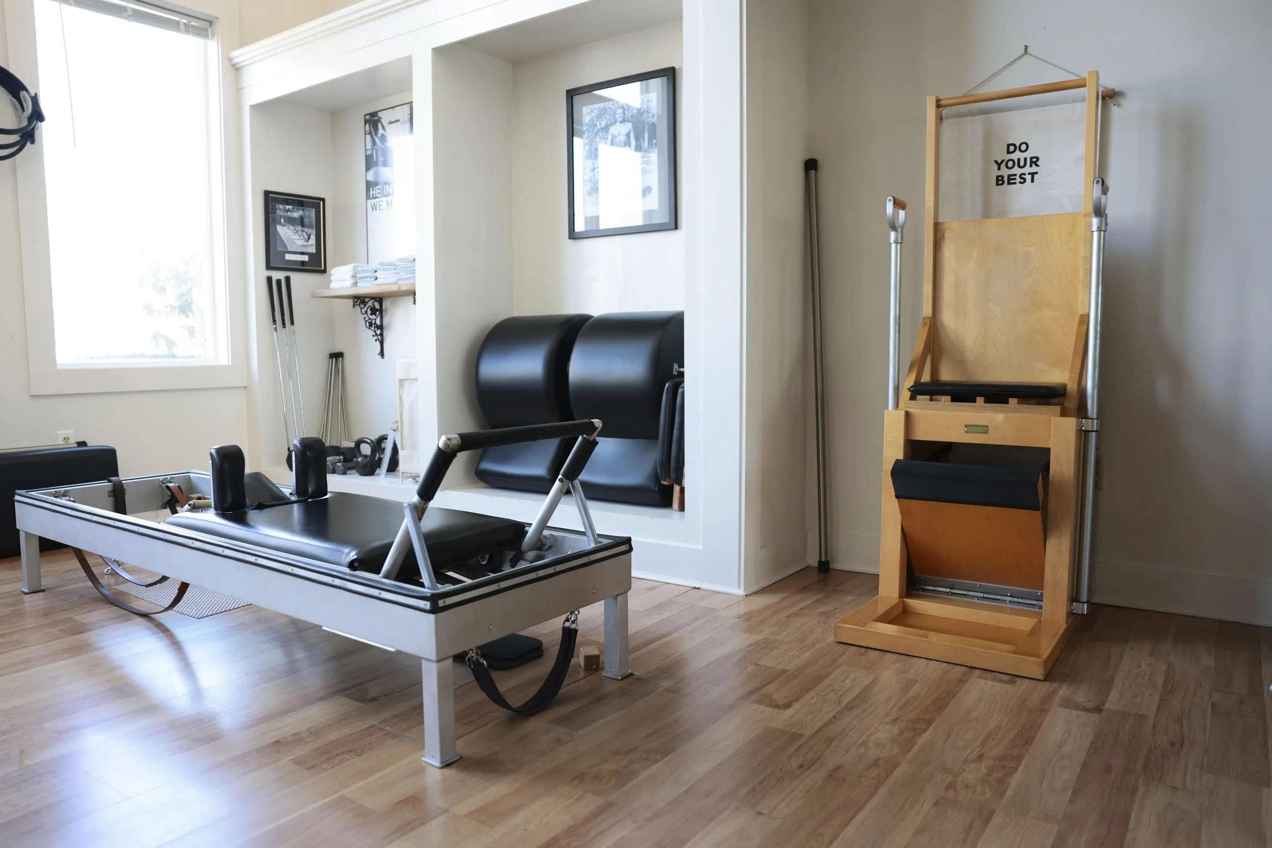 Rehabilitation or physical therapy room with balance equipment, mats, and motivational posters.