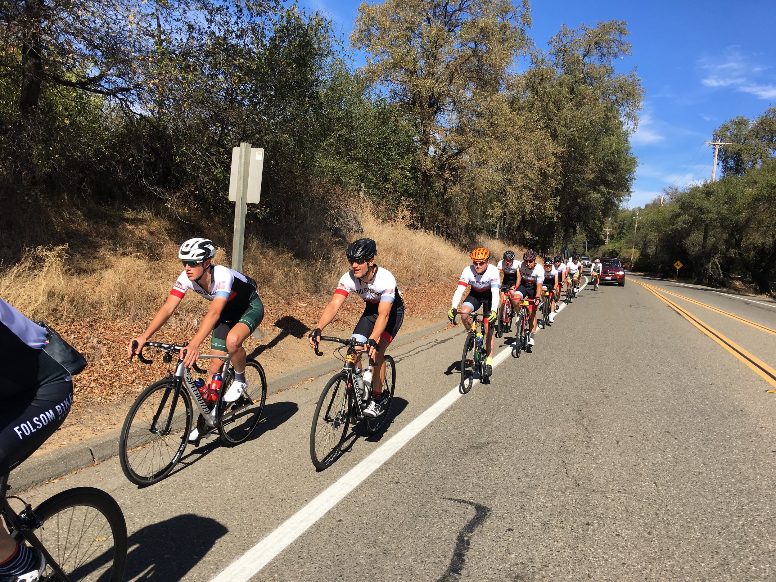 Athleticamps organized group riding down Foresthill road