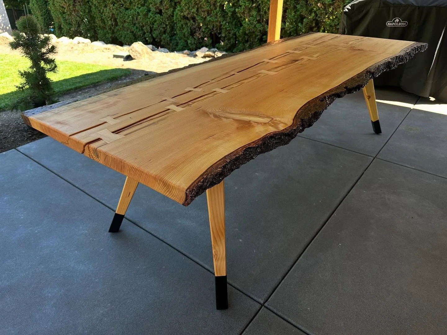 Delivery Day for this beauty! Super special project as this slab came from a tree at the client&rsquo;s childhood home. #outdoorfurniture #diningtable #outdoors #fir #liveedge #bark #on @superclearepoxy @penofin #customfurniture #portland