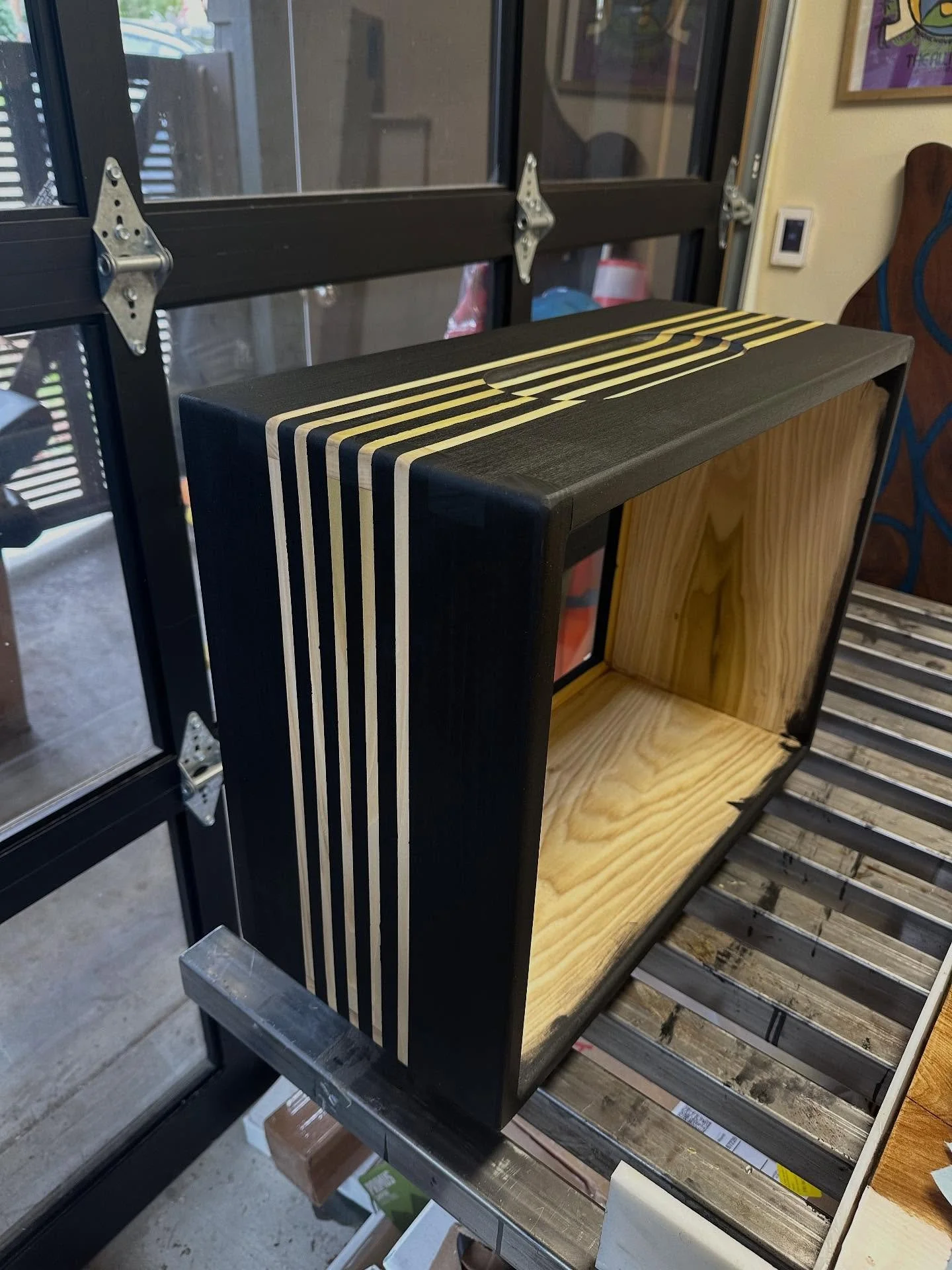 Speaker Cab in progress. Poplar with @rubiomonocoatusa Intense Black Pre Color Easy and clear Oil.  Tape held up pretty well for the clear wood stripes! Not perfect, but no-one was expecting that 😊. #speakercabinet #speakercabs #sound #guitar #chasi