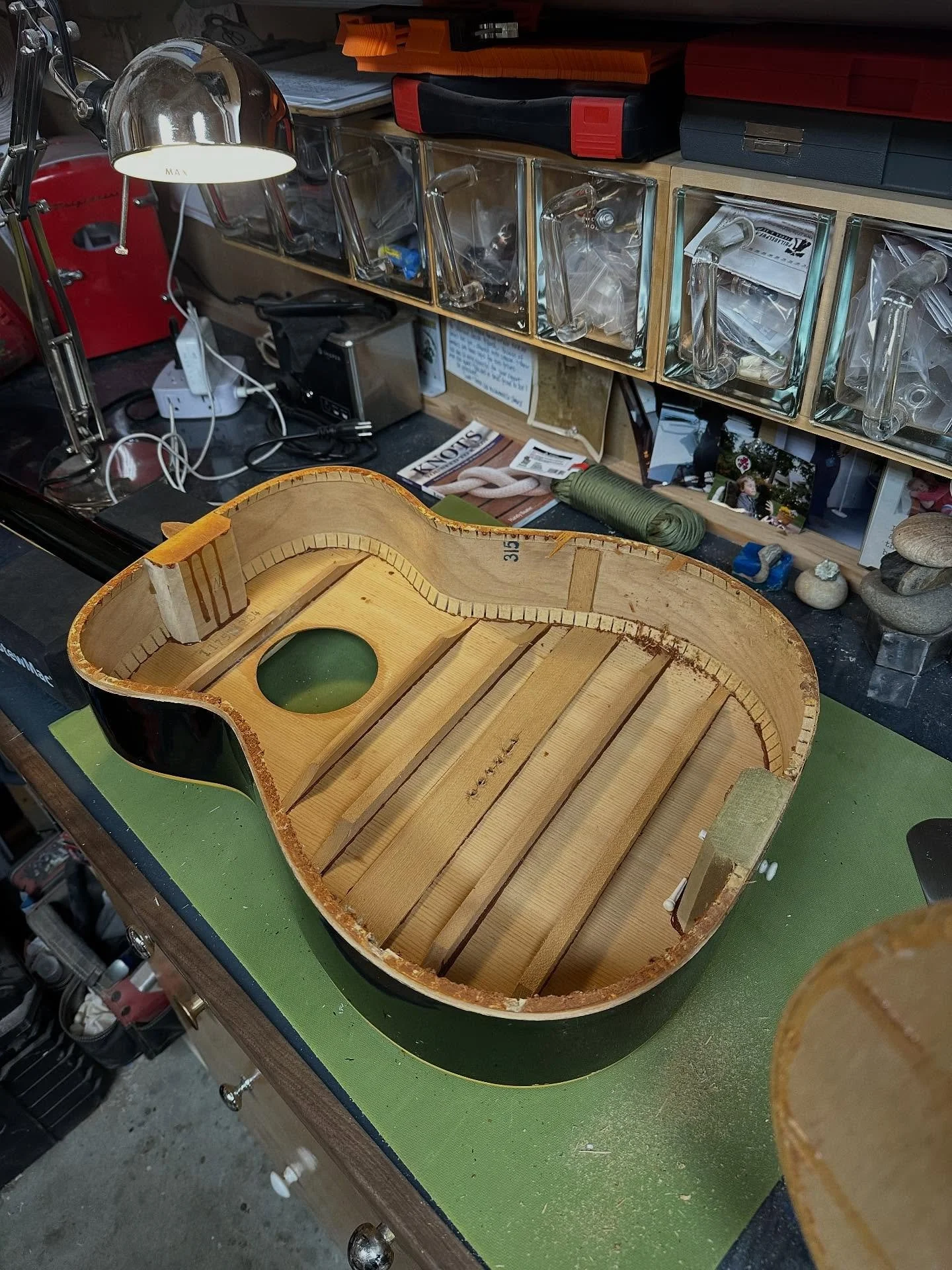 Pretty big rebuild on this &lsquo;71 Harmony Sovereign Jet Set Mini Jumbo.  Back is severely warped.  Removed and trying to flatten with heat and weight.  Since the back is off, would be a shame not to redo the top bracing from ladder to X.  This thi