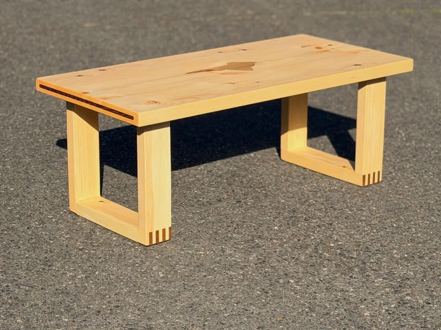 Sweet Pine coffee table for an unheated lake cabin. Pine and roomy/lots of glue surface joinery will hopefully help this table withstand the temp and humidity swings when the owners are not there.  Accents in Red Cedar and lake shape and name laser e