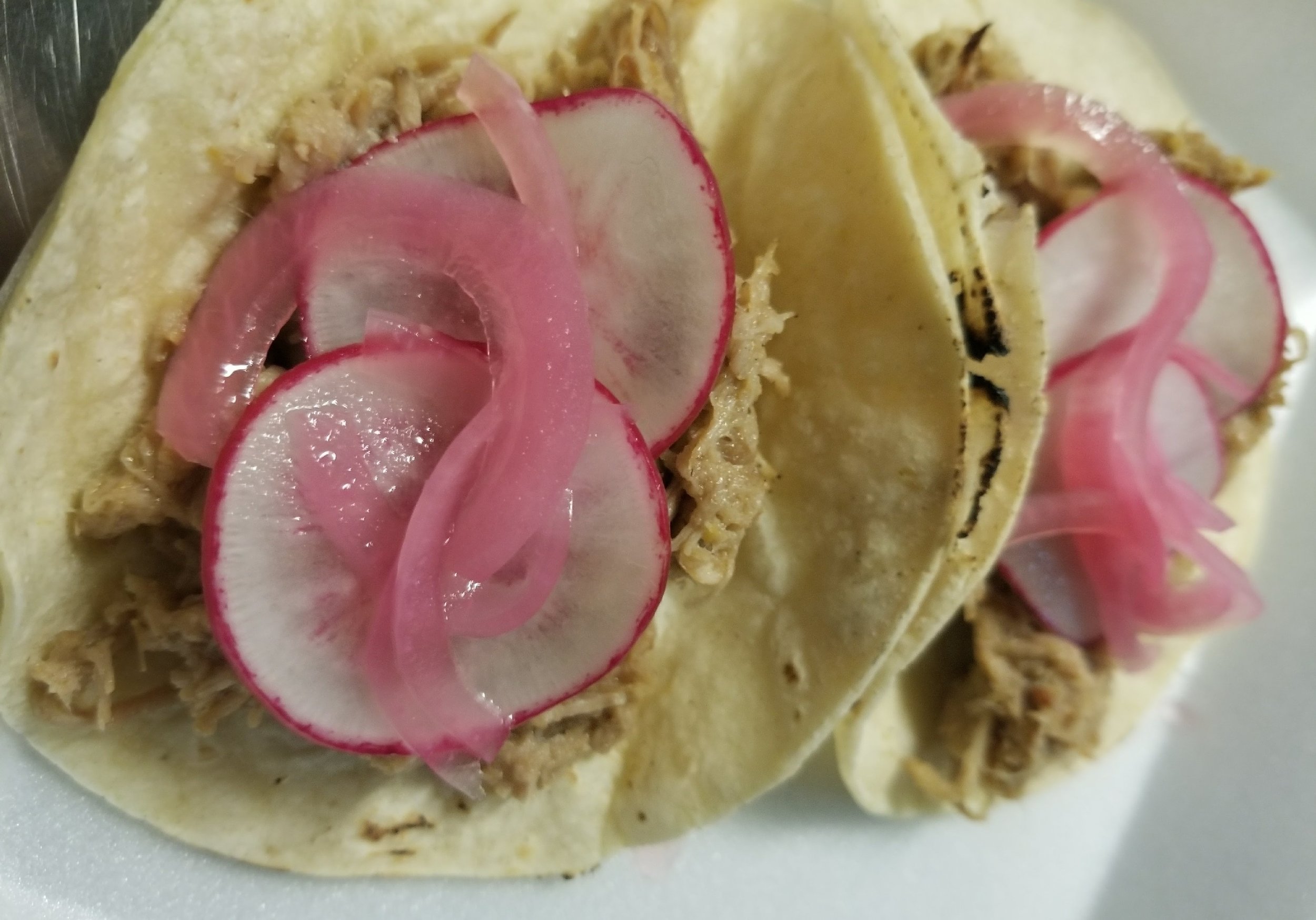 our yuzukosho pulled pork with hand pickled onion and fresh radish