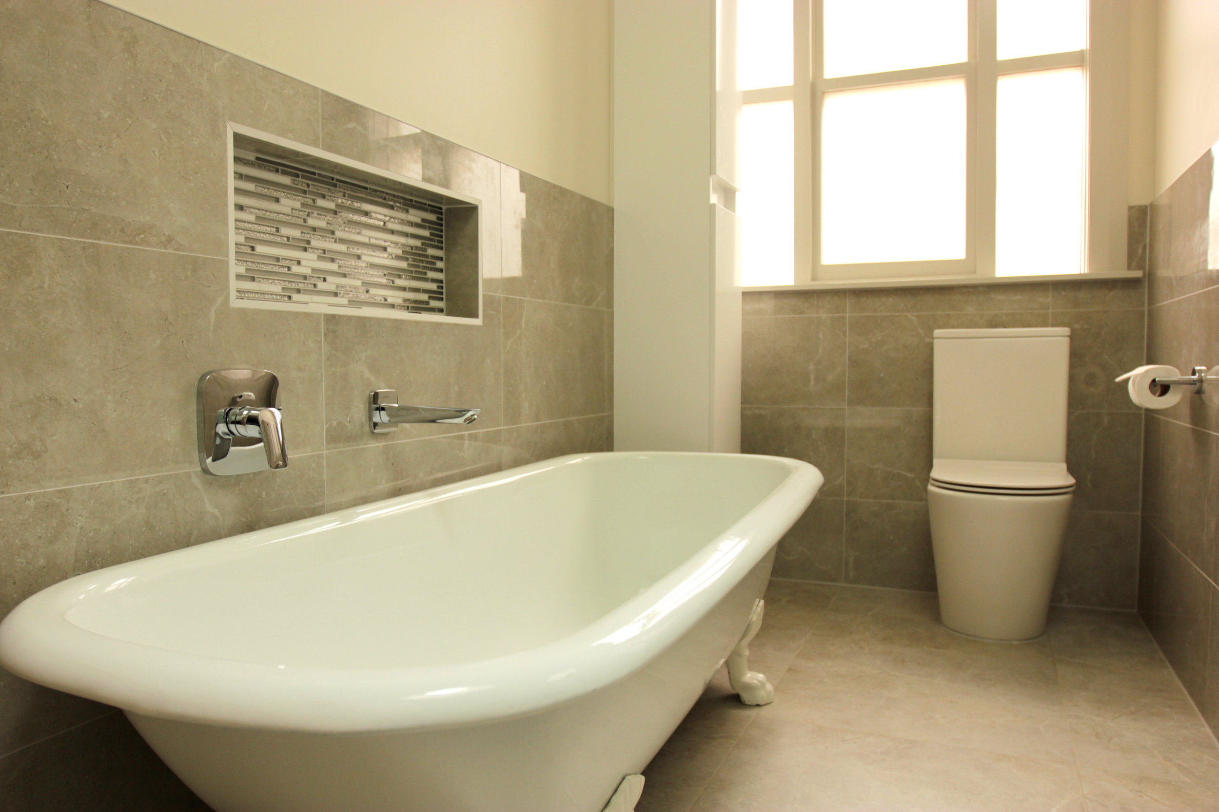 FAMILY BATHROOM RENOVATION   Features: Recessed Shelf, Free Standing Bath and Large Tiled Flooring