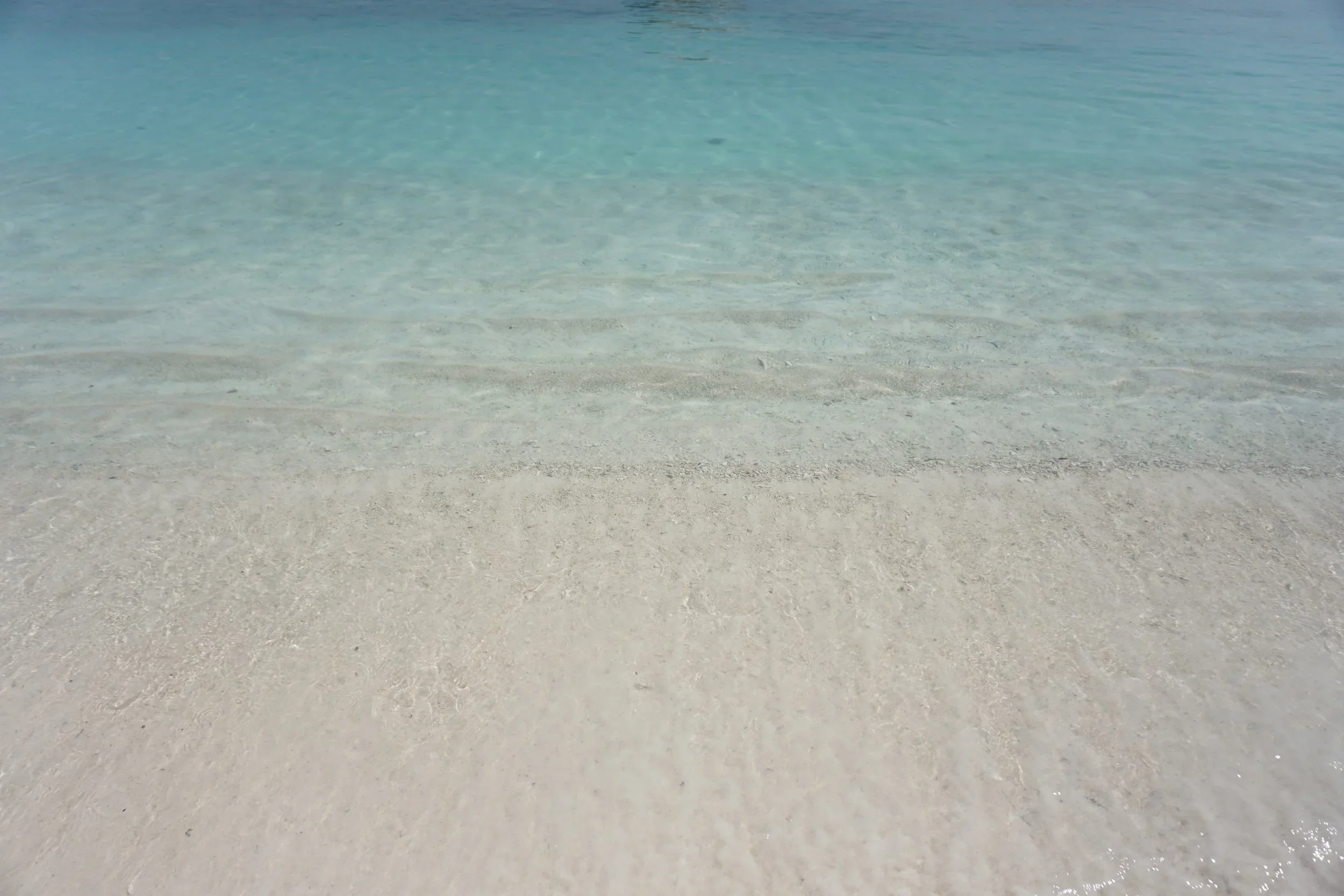 Clear shallow water over a sandy seabed