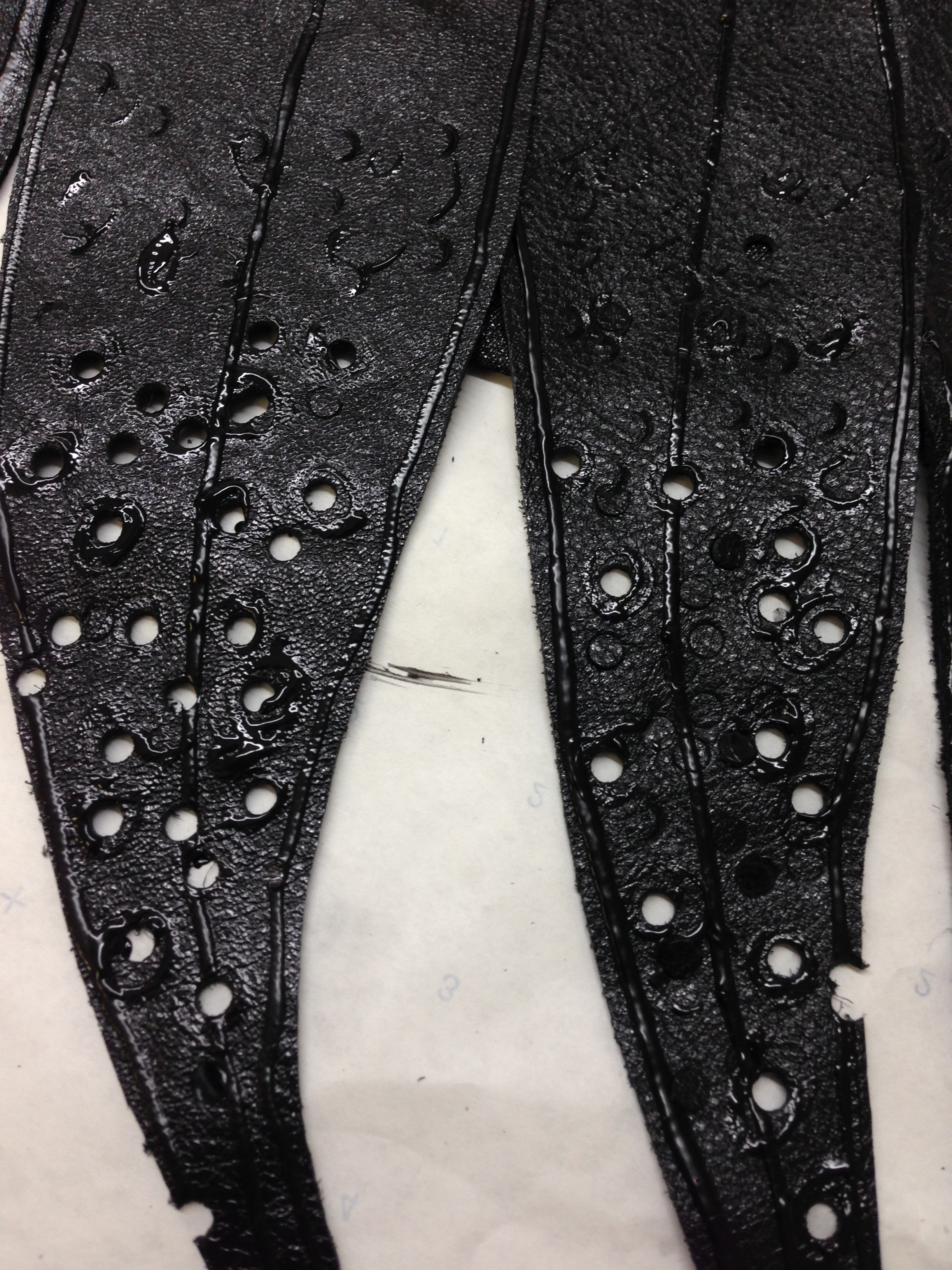 Devil cape detail leather feather.JPG