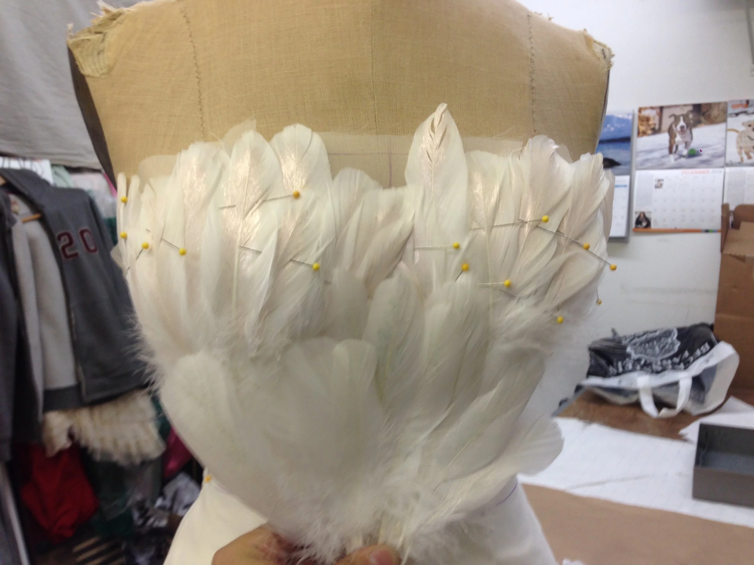  The feathers were painted by hand with irridescent paint to help give the heavenly glow to them.But I have to admit: Sewing them was not easy!&nbsp; 