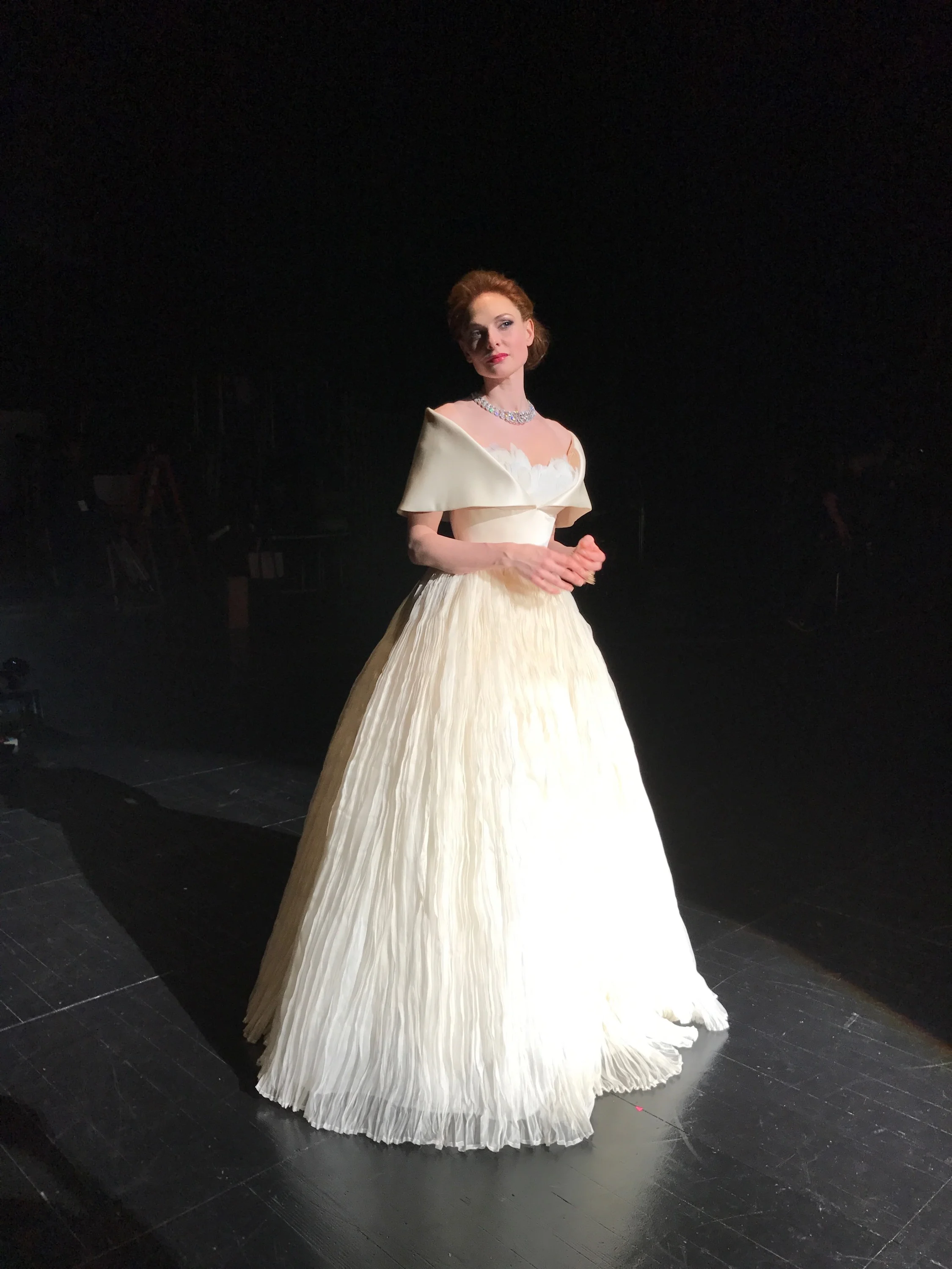  What not to like about this picture : A beautiful woman in a beautiful gown. Taken onstage before filming...Admiring.... 