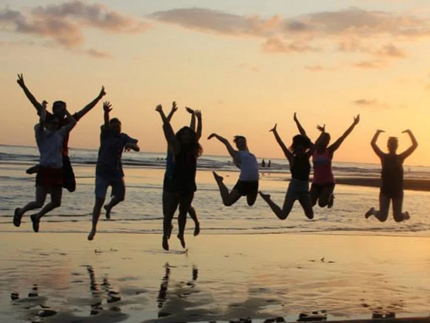 students-jumping-beach.jpg