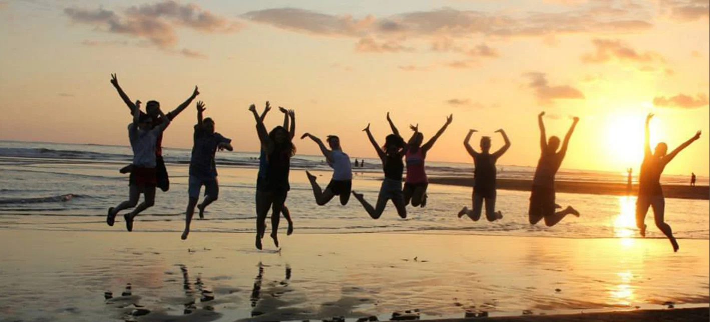 students-jumping-beach.jpg