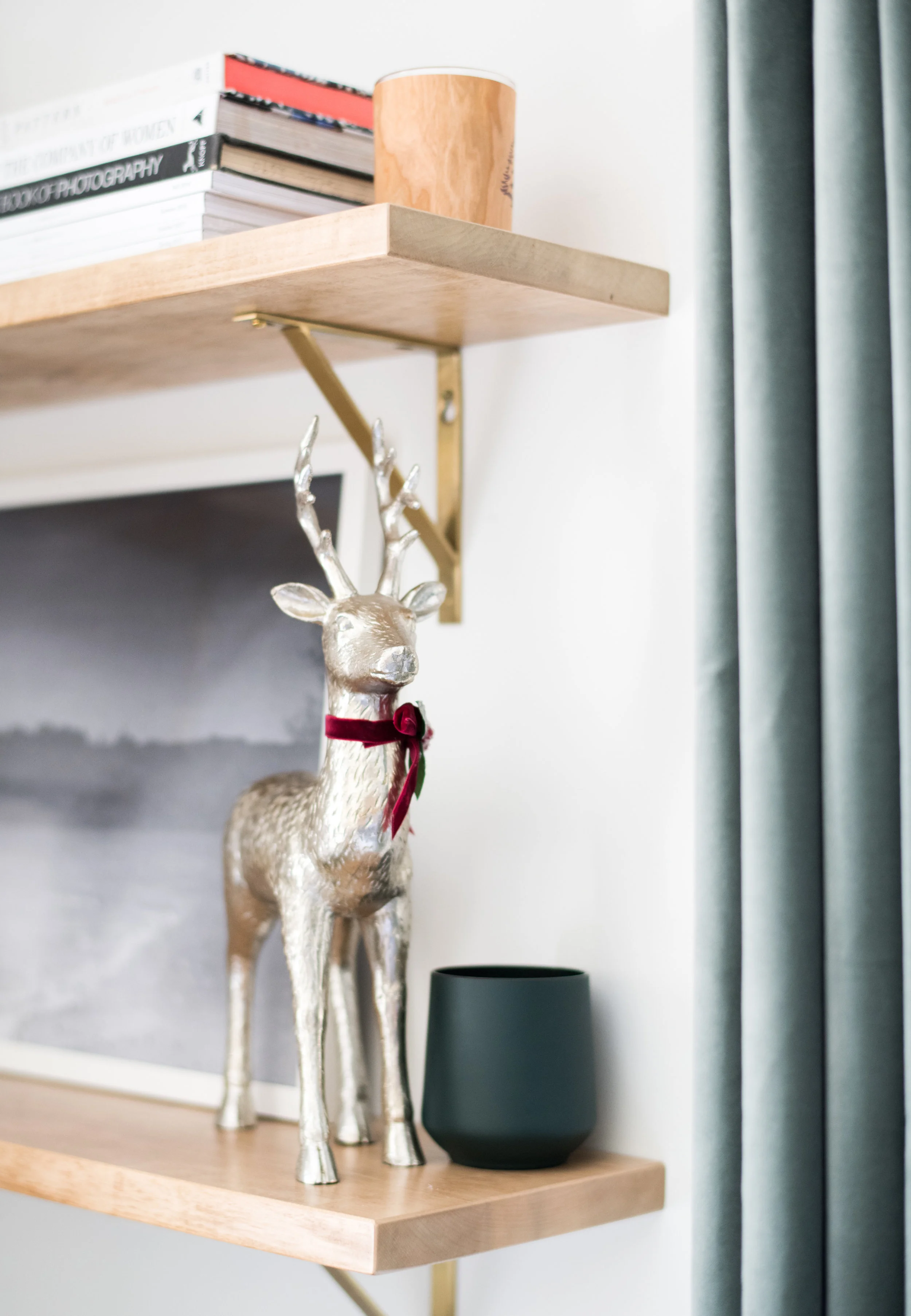 Our living room shelves were rearranged a bit to include some holiday-themed objects.