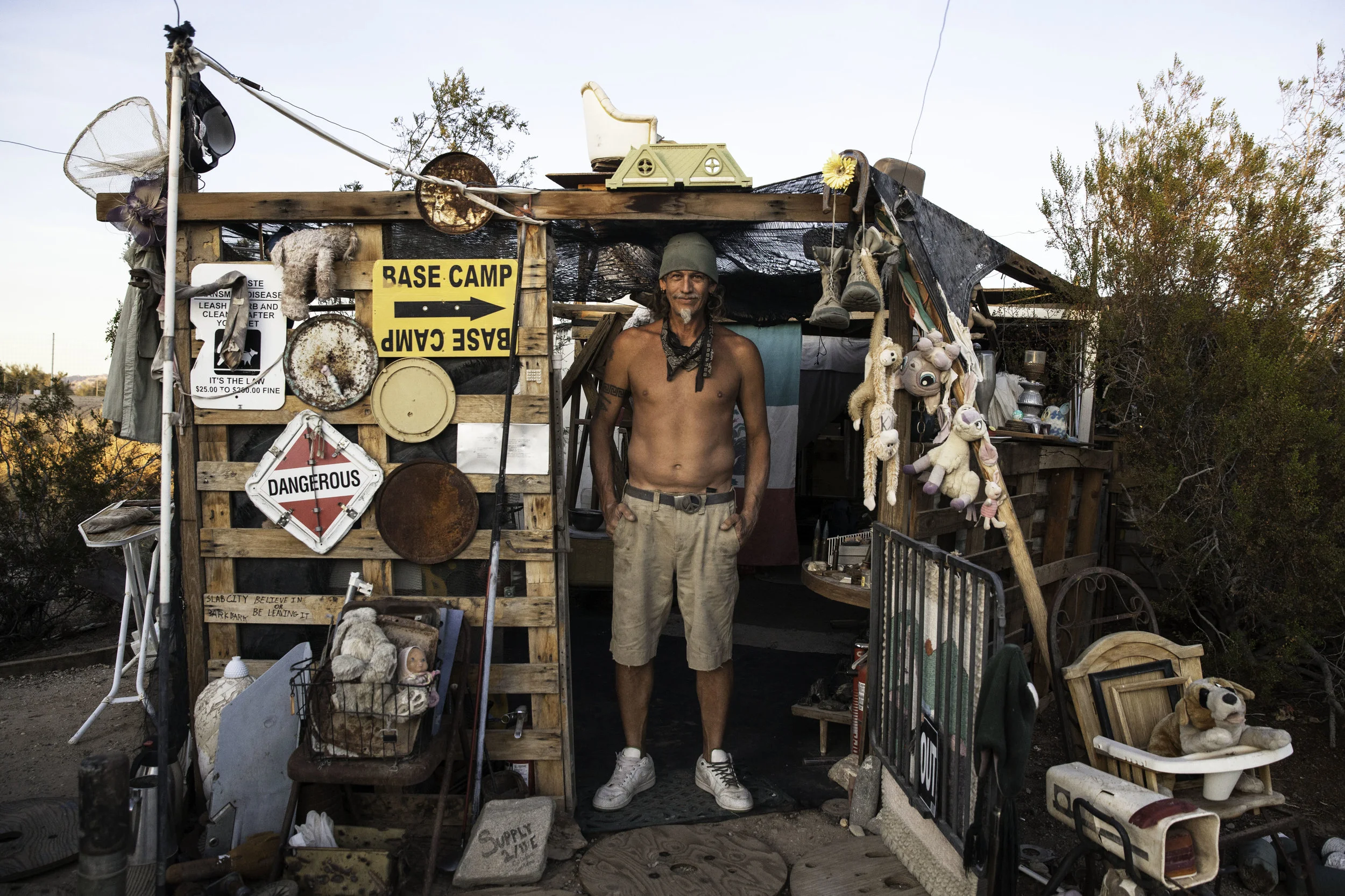 He calls himself "The Vet" who is originally from Puerto Rico and has been living in Slab City for three years. He built his home with materials that he has found around the community. He is currently installing a shower and building a bathtub so that he can sit there during the hot days to cool off. 