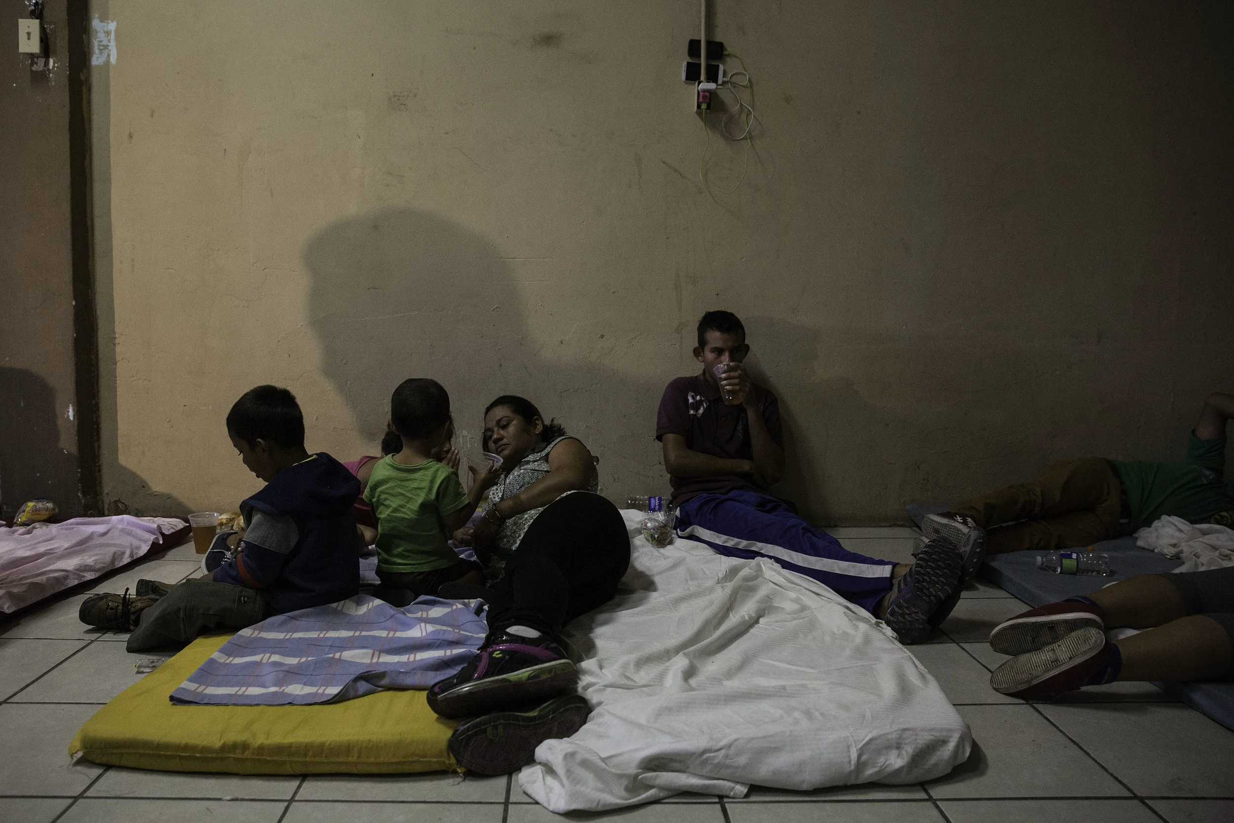 Two busses with migrants from Central America arrive in Mexicali, MX, where they spent about two hours relaxing, eating sandwiches, drinking iced tea and charging their cell phones on April 24, 2018.