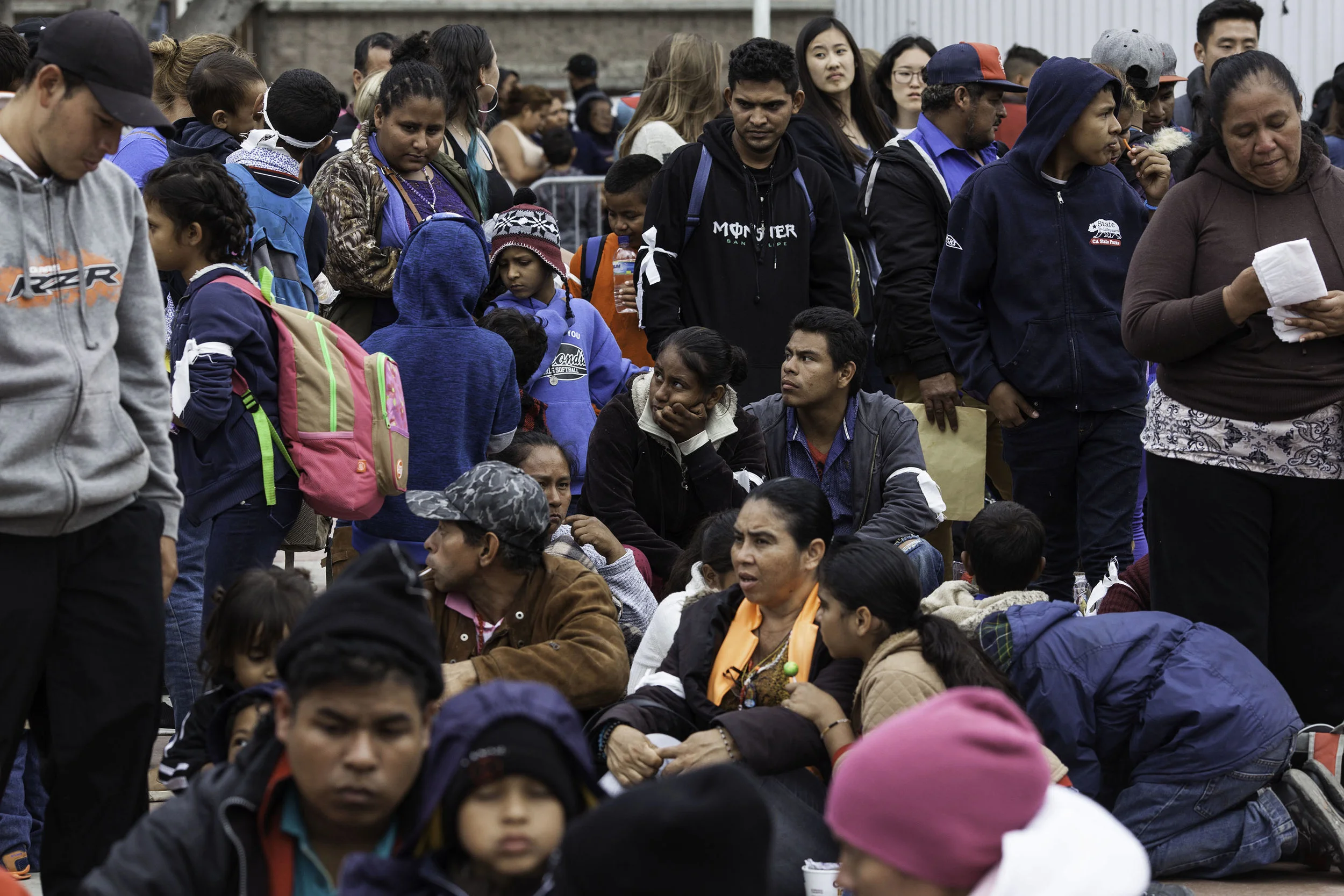 After traveling for a month through Mexico, there is confusion as to whether people are allowed to enter the Port of Entry in Tijuana, MX. Migrants wait outside to see if they will be able to seek asylum in the United States on April 29, 2018.