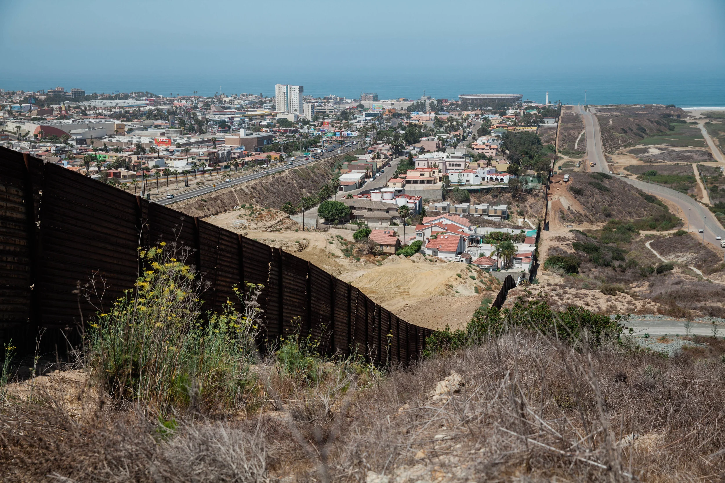 The view from "Bunker Hill" area looking at Mexico, the border wall that divides the United States and Mexico can be seen on the left.