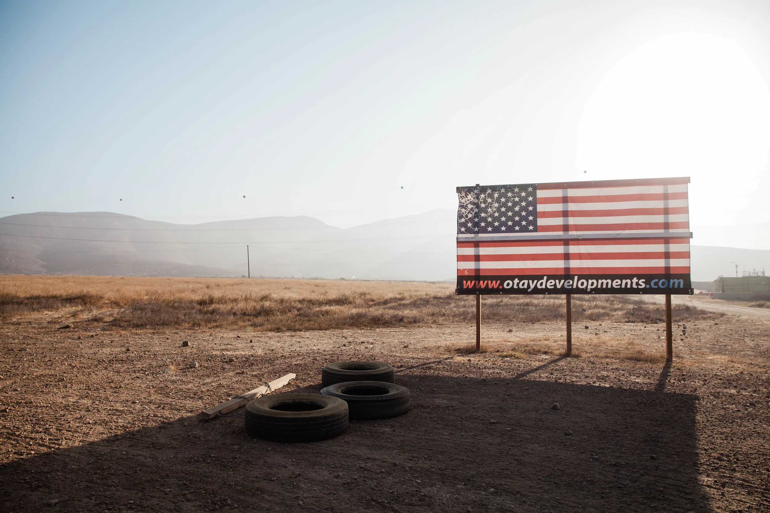 Outside the gate early morning where the 8 border wall prototypes are displayed in Otay Mesa.
