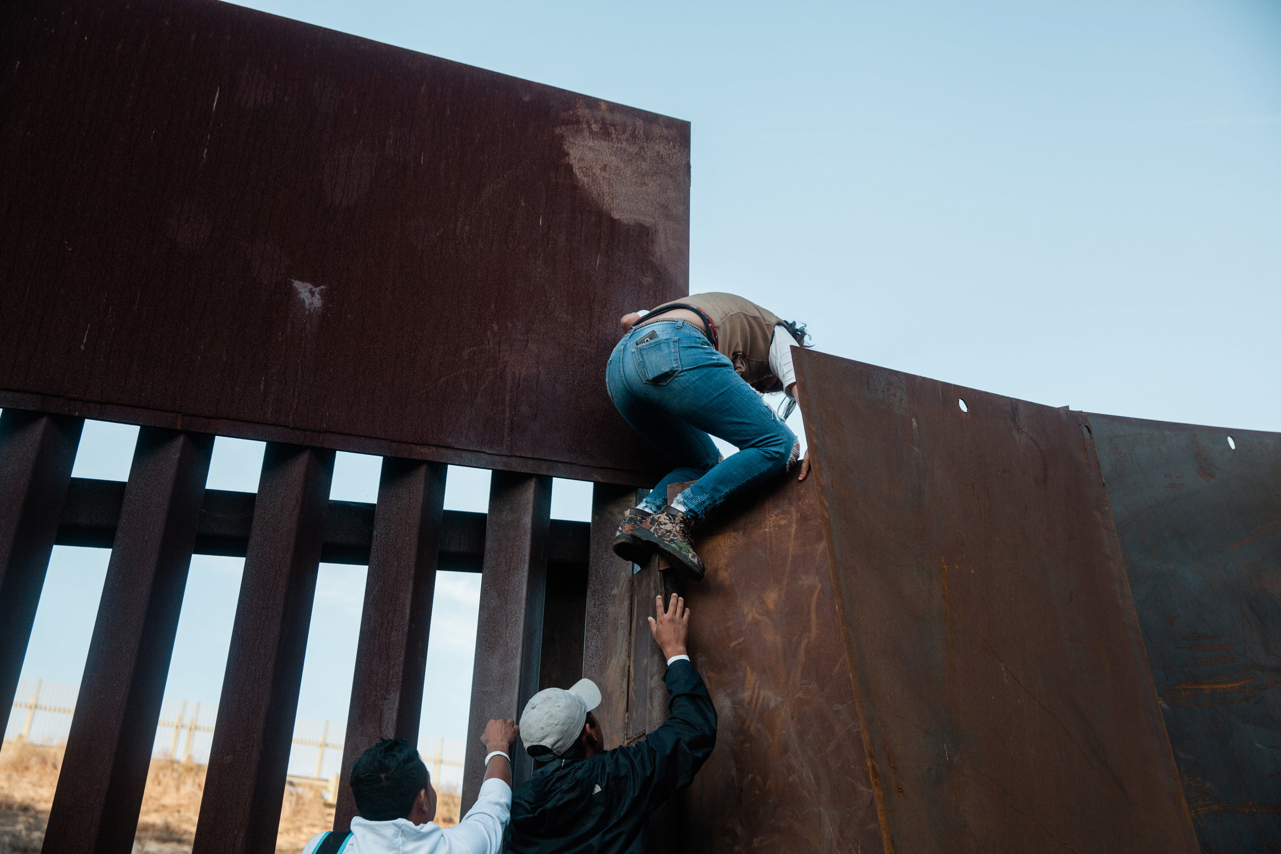 With growing frustration at the length of the asylum process, a dozen migrants decide to jump the border fence that divides the United States and Mexico on December 2, 2018 at Playas de Tijuana, Mexico.