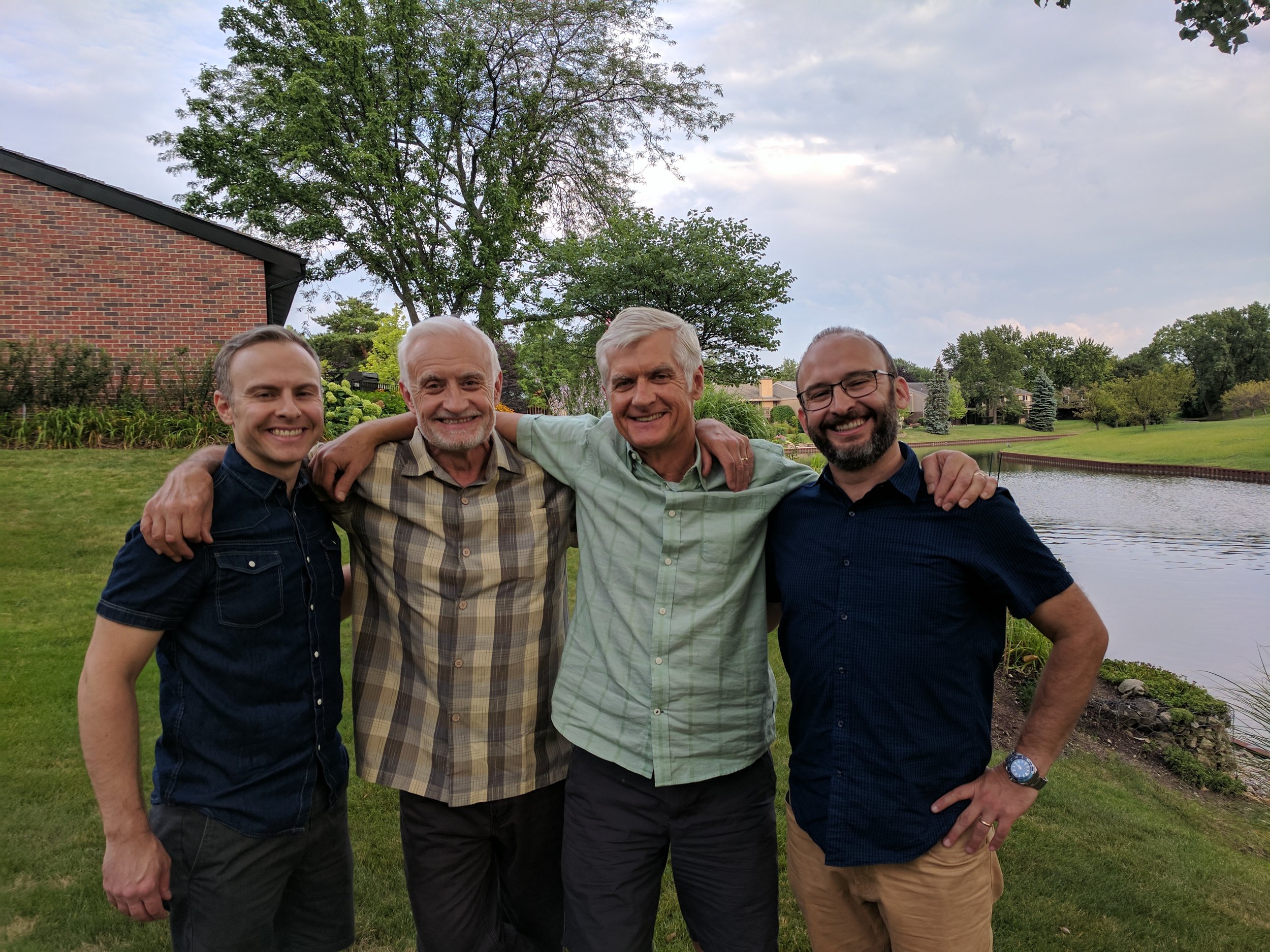 Andy with his dad, uncle and brother before a family dinner