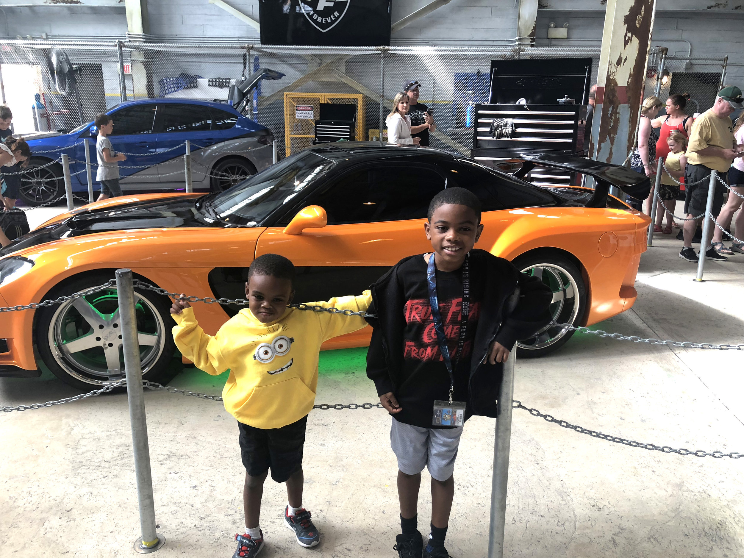The boys enjoying a car show