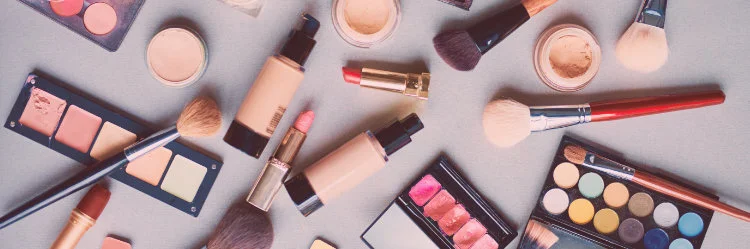 Makeup scattered on table