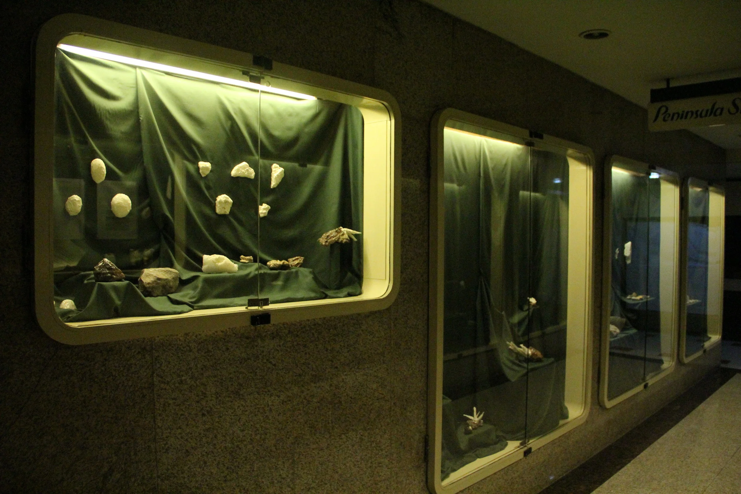   Aggregate ,&nbsp;found rock and mineral fragments, resin, plaster, gold leaf, PE foam, dimensions variable, installation view at I_S_L_A_N_D_S. 