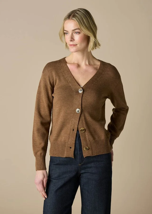 Woman wearing the coffee (light brown) colour variant of the uimi knitwear | Agnes Jersey V-neck Cardigan made from 100% Merino wool.