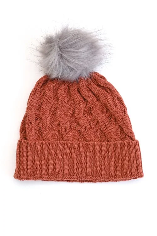 Papaya (orange) colour variant in the Mabel Pom Pom Beanie from uimi knitwear
