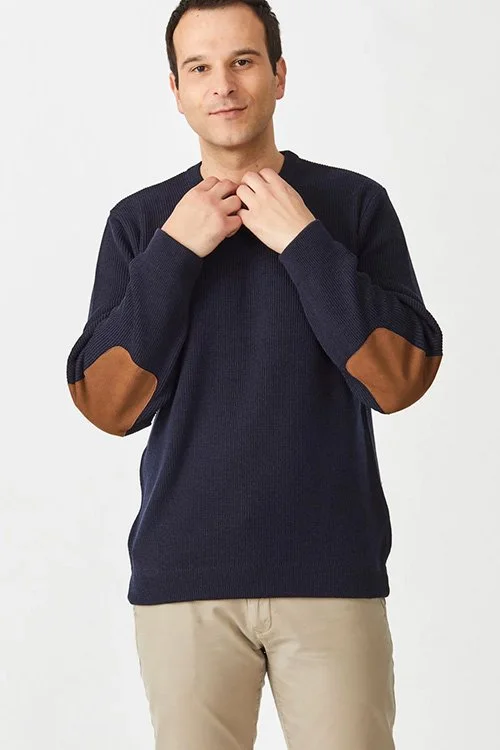 man wearing the navy colour variant of the Aklanda — Burke Rib-Knit Crew Sweater made from Australian Merino wool)