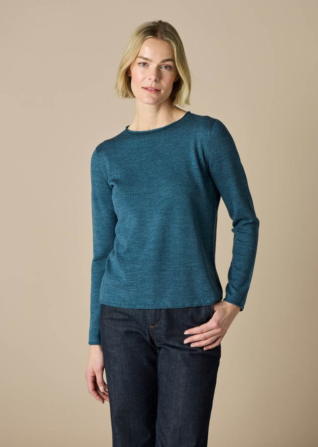 woman wearing the uimi knitwear phoebe top merino wool bluebell colour variant