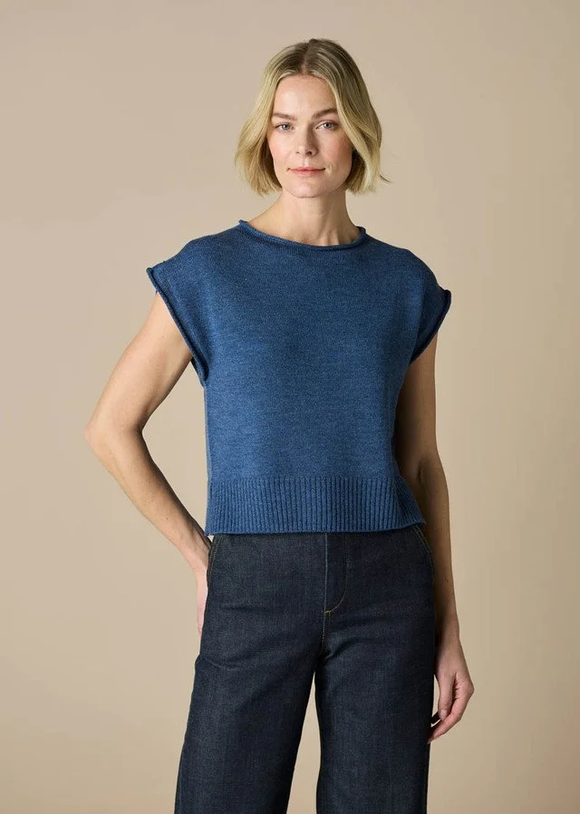 Woman wearing the bluebell version of the uimi knitwear | Agnes Jersey Vest made from 100% Merino wool.