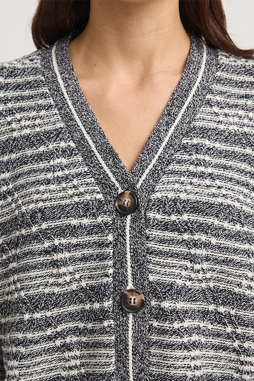 Closeup of the vee neckline of the Diamond Cable Cardigan from Toorallie made from 100% Merino Lambswool