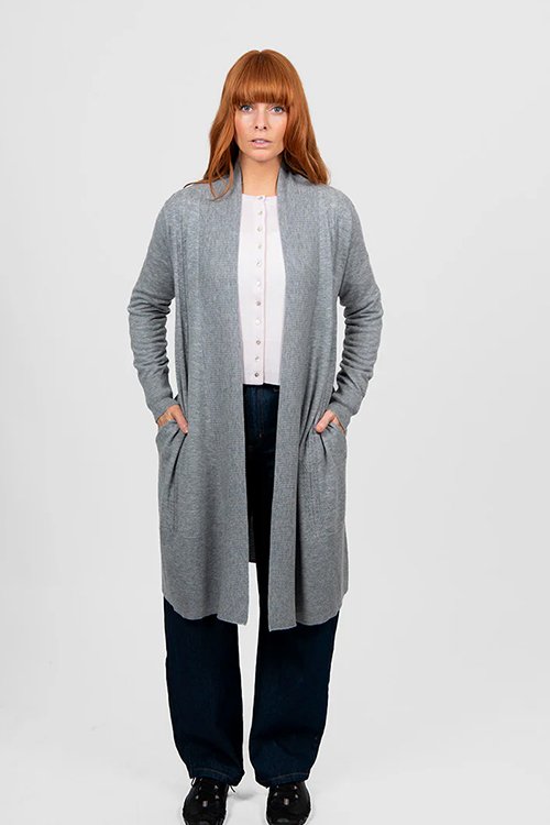 Mid Grey colour variant next to a woman wearing the Bridge and Lord Emily longline cardigan.