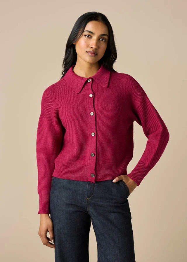 Woman wearing the magenta colour variant in the Pearl Cardigan from uimi knitwear.