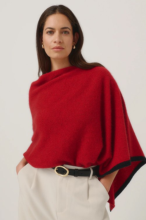 Woman wearing the Merinomink |Two-tone Poncho (Merino Wool and Possum Fur) Rata red colour variant