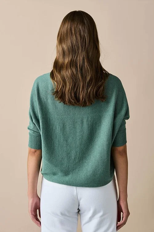 back view of the Sage green colour variant in the uimi knitwear — Clara Jersey Shrug made from Egyptian Cotton and Cashmere