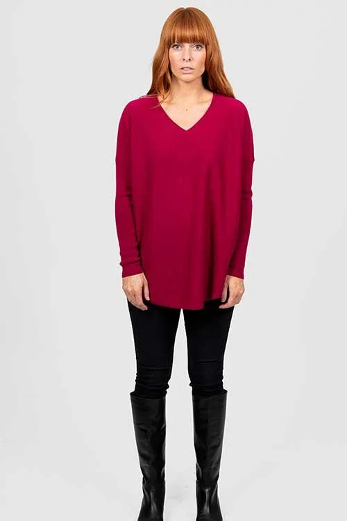 Woman wearing the Bridge & Lord | Queen Vee Curved Hem Pullover made from Merino wool and cashmere in the Cassis (Dark Crimson) colour variant