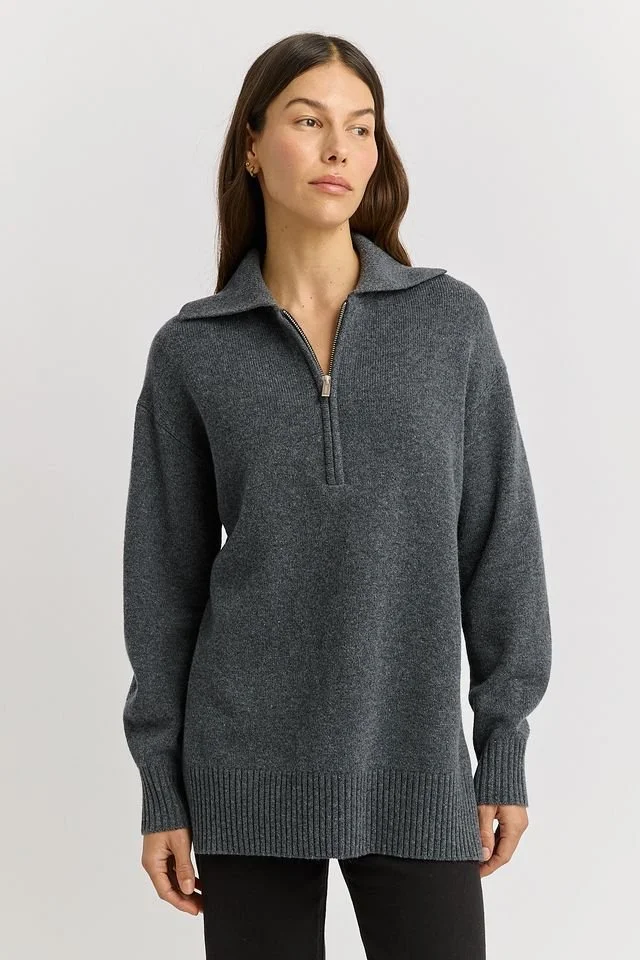 Woman wearing the Zinc grey colour variant of the Toorallie Relaxed Longline Zip Polo Top made from 100% Merino Lambswool