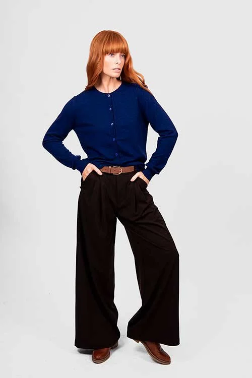 Woman wearing the Carbon Blue cardigan made by Bridge and Lord