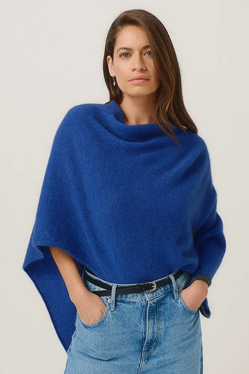 Woman wearing the MerinoMink Two-tone Poncho — Merino Wool and Possum Fur, Dusty blue colour with slate trim,