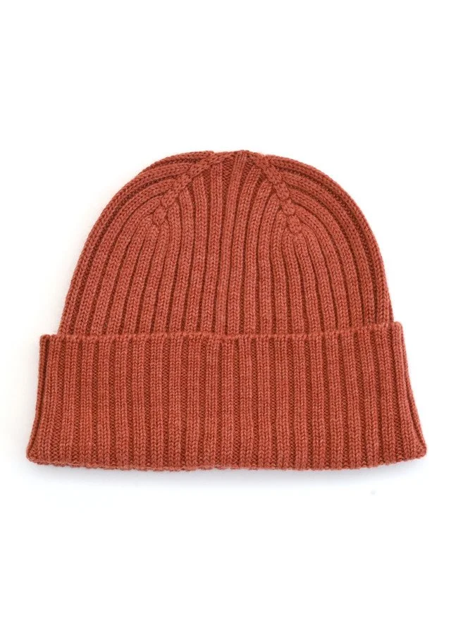 Papaya colour variant of the merino wool Teddy Beanie from uimi knitwear.