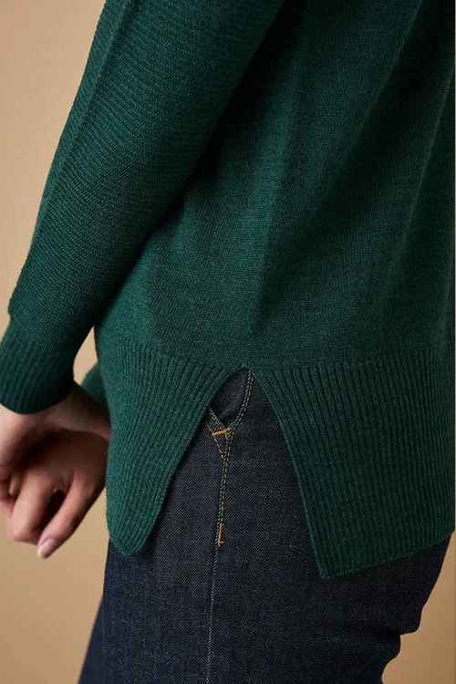 closeup of the Hunter (green) colour variant of the uimi knitwear Etta Top made from Merino Wool